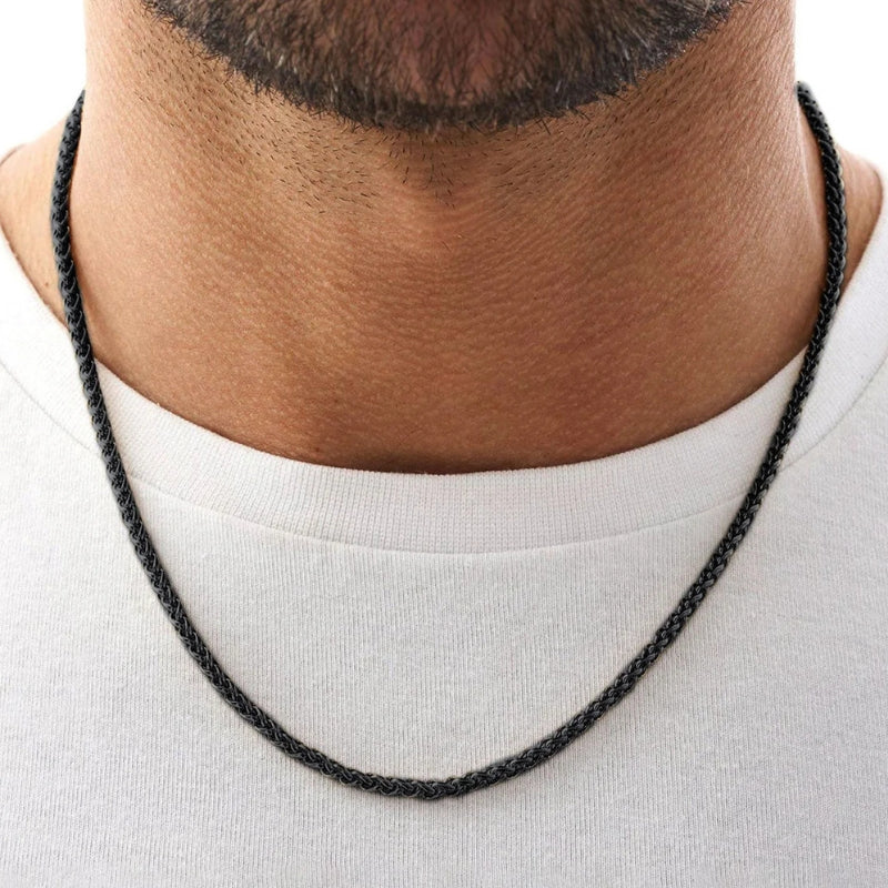 Schwarze Weizenkette aus Edelstahl für Herren, robuste Halskette mit geflochtener Struktur, maskuliner Herrenschmuck.